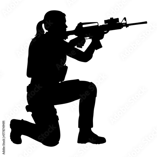 Silhouette of woman aiming rifle kneeling