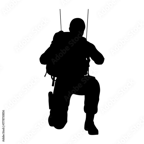Soldier descending with parachute military descent