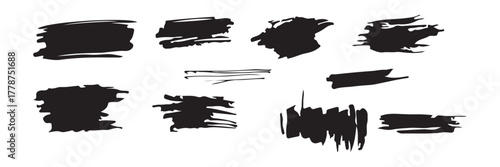 Collection of abstract black ink brush stroke splatters and smudges in silhouette