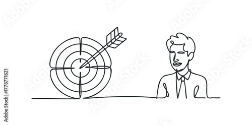 Man standing beside a target with arrow in bullseye