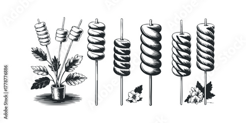 Various Marshmallows on Sticks with Flowers and Plant