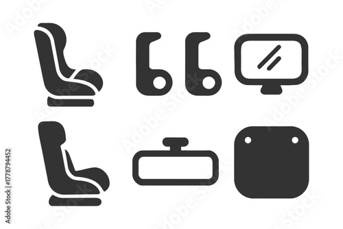 Set of baby car seat icons and accessories in simple black design.