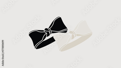 A graphic illustration of two bow ties one black and one white on a light gray background space 100