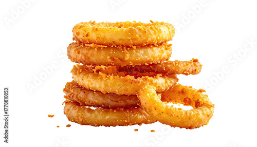 Stack of crispy golden brown fried onion rings on black background