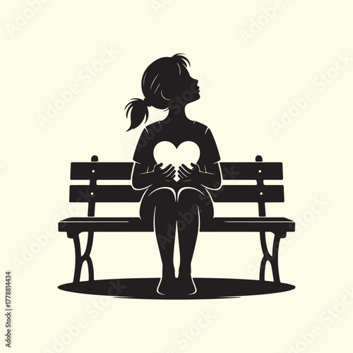 Silhouette of a Girl Holding a Heart on a Park Bench