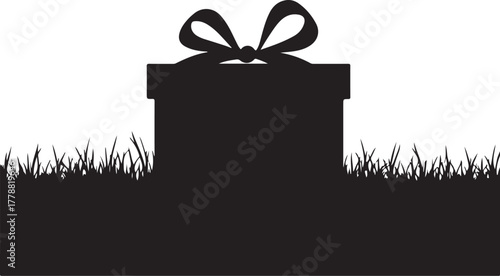 Black silhouette gift box with bow on grass present