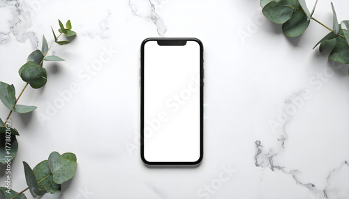 Elegant smartphone mockup with eucalyptus leaves on modern marble background ready for your design