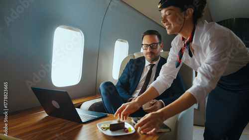 Tableau sur toile Flight attendant providing high-class service