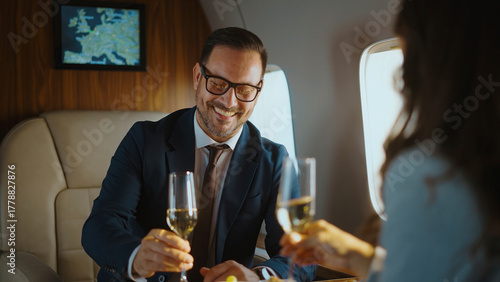 Tableau sur toile Happy business partners enjoying a champagne toast to celebrate their achievemen