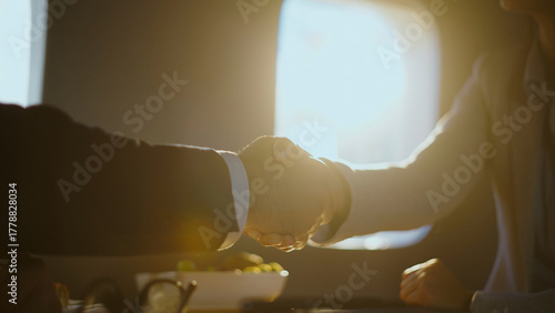 Photography Professionals confirming a successful partnership with a handshake during a corp