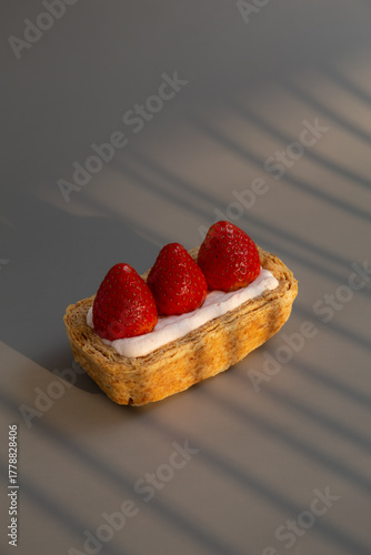 Strawberry flaky pie, Sweet dessert from Korea on grey background.