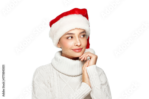 Beautiful woman in a white knitted sweater and santa hat isolated on a transparent background. Christmas or New Year festivities. Holiday and Party