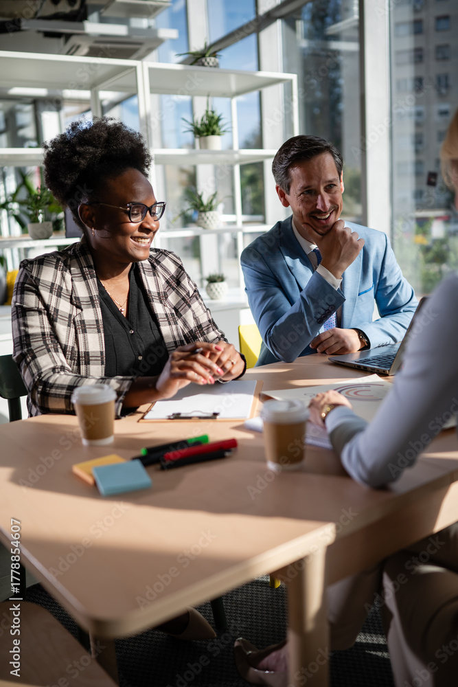 Fototapeta premium Diverse business colleagues collaborating during informal office meeting