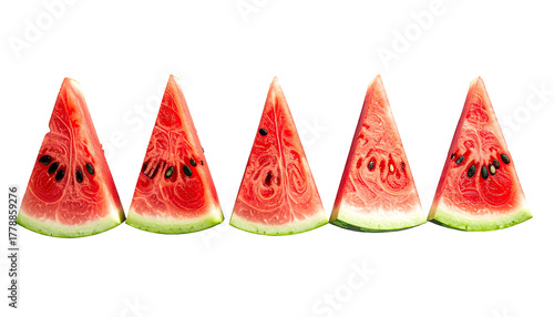 Five slices of watermelon with seeds in a row on dark