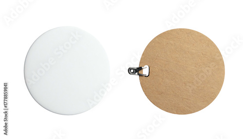 Round object, white face; brown backing, metal clip fixture