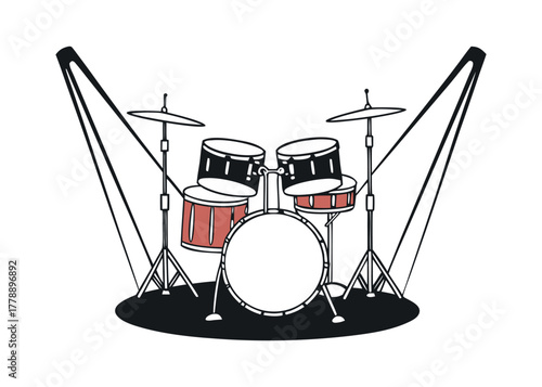 Drum kit set up on stage with spotlight