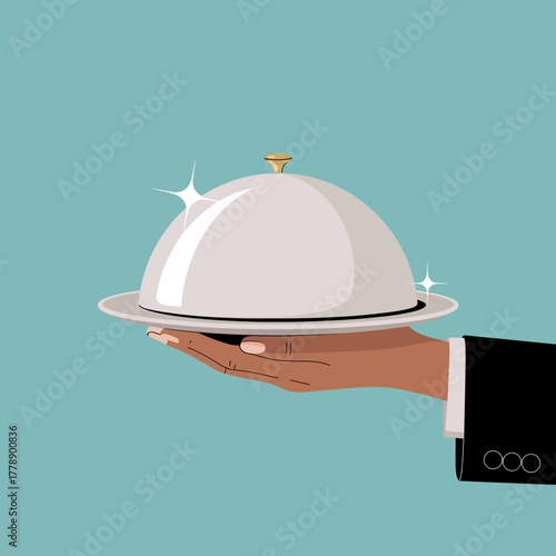 A stylish silver cloche held in a hand against a contrasting background, representing the artistry of fine cuisine and the beauty of presentation for gourmet experiences.