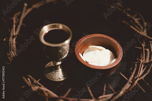 Carta da parati Communion bread and wine with the Holy Bible and crown of thorns, symbolizing the sacrifice of Jesus Christ, the passion, salvation and Christian faith in the Eucharist and Lord Supper