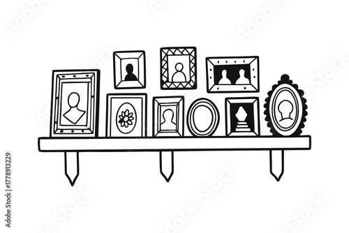 Collection of various framed pictures displayed on shelf