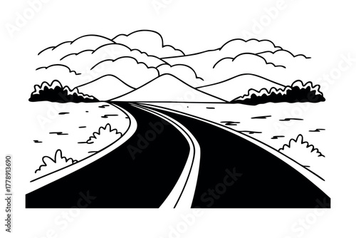 Winding road leading towards distant mountains and clouds