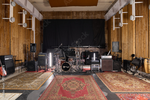vintage rehearsal space prepared for musicians, cozy music studio equipped for recording