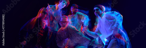 Street dancers posing under vivid motion blur lights. Concept of hip hop culture, artistic expression, performing arts visuals, and lifestyle branding promotion. Banner