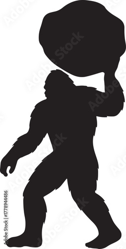 Bigfoot silhouette posing with a large boulder