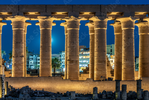 Row of Illuminated Papyrus Columns at Luxor Temple at Night with Moon