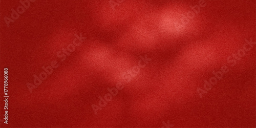 Abstract textured background with soft blurred red and pink hues and subtle light effects