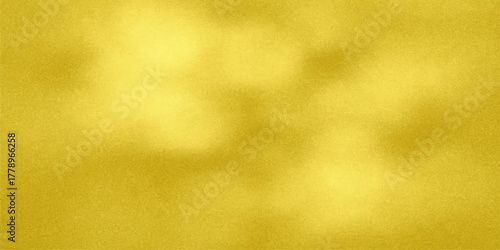 Abstract golden yellow textured background with soft light and shadow effects