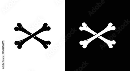 A graphic illustration of two crossed bones, shown as a black silhouette on a white background and its inverse, white on black.