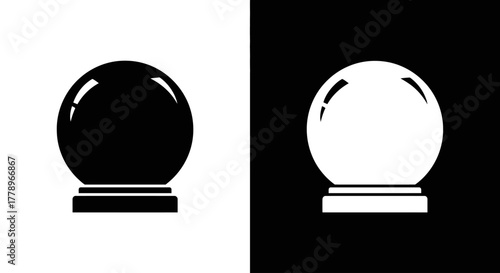 A pair of simple, flat icons depicting a magic crystal ball, one black on white and one white on black.