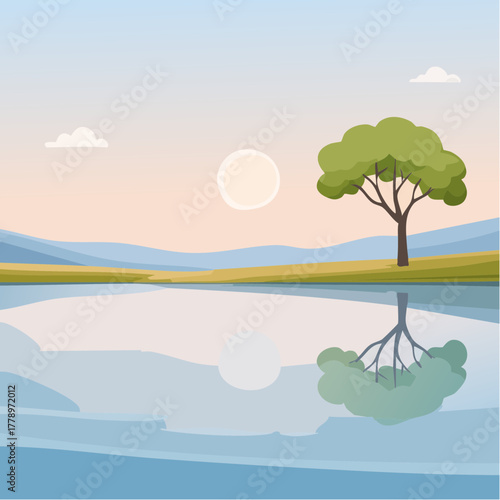 solitary tree reflected in the still waters of a foggy lake at sunrise