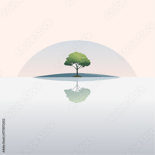 solitary tree reflected in the still waters of a foggy lake at sunrise