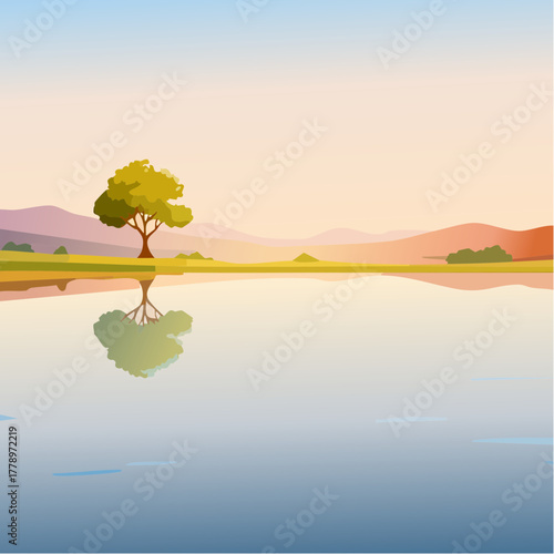solitary tree reflected in the still waters of a foggy lake at sunrise