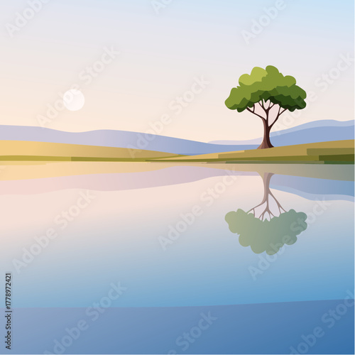 solitary tree reflected in the still waters of a foggy lake at sunrise