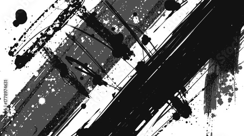 Abstract black ink brush strokes and splatters on a