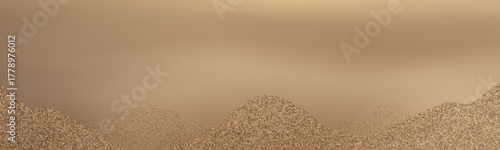 Abstract golden sand dunes landscape with smooth flowing shapes.