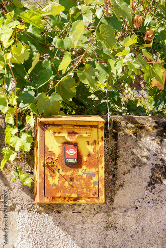 Old vintage yellow mail box in Bulgaria