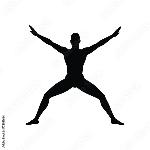 Man practicing yoga in a dynamic silhouette pose