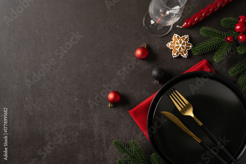 Canvas Print A flat lay top view refined holiday table scene featuring a dark plate, gold for