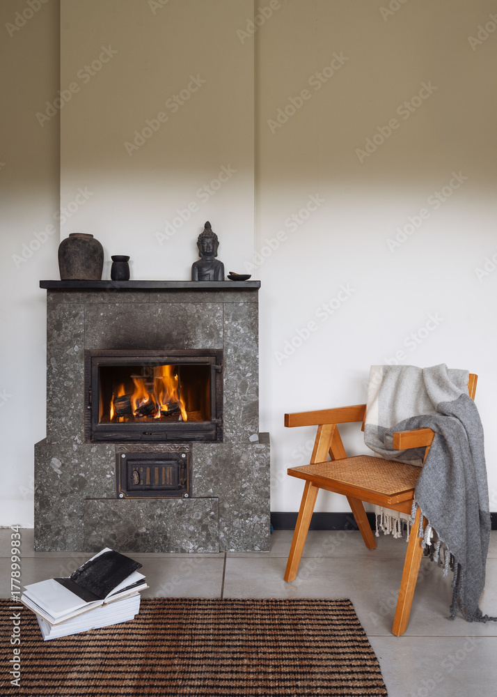 Naklejka premium Cozy fireplace in a modern living room for warmth and comfort in winter
