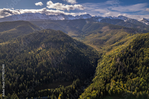 Fototapeta Naklejka Na Ścianę i Meble -  Aerial view of Tatra mountains and forested valleys, autumn in Poland