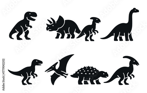 Silhouette of various dinosaurs on dark background