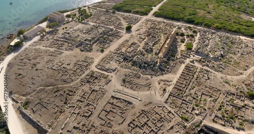 Aerial view of the archaeological site of Selinunte, located in province of Trapani, Sicily, Italy. At the center of the archaeological park is the Temple of Apollo. It overlooks the Mediterranean sea