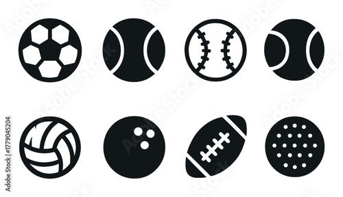 Collection of eight black silhouette sports balls on dark background