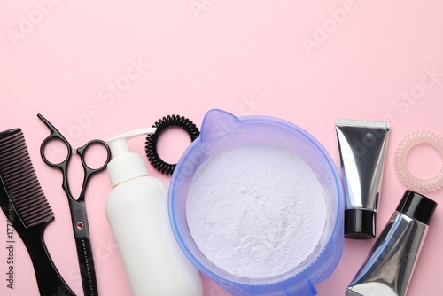 Obraz na plátne Professional tools and products for hair dyeing on pink background, flat lay
