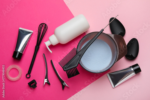 Obraz na plátne Professional tools and products for hair dyeing on color background, flat lay