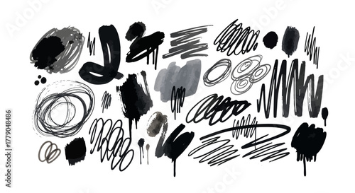 Abstract ink brush strokes and scribbles on white background conveying artistic expression and