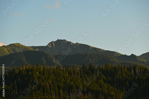 Fototapeta Naklejka Na Ścianę i Meble -  Kasprowy Wierch, Zakopane, Poland. A peak of a long crest in the Western Tatras. Cloudless summer evening